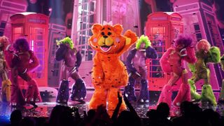 Miss Teddy performs on stage with backup dancers on The Masked Singer