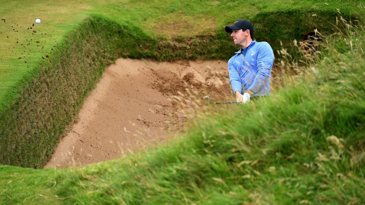 Rory McIlroy hits from the coffin bunker on the 8th hole during the second round on day two of the 145th Open Championship at Royal Troon on July 15, 2016