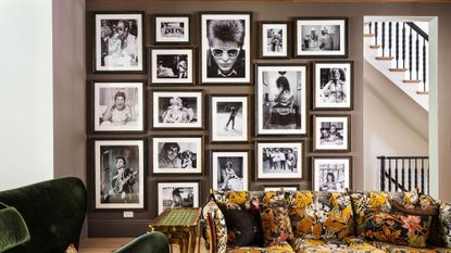 Pattern-filled NYC parlor room featuring a statement gallery wall of black-and-white photography