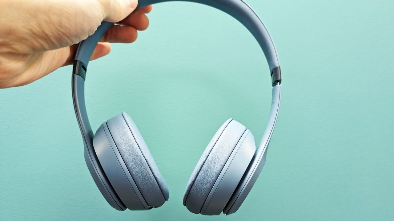 Beats Solo 4 held in hand face on