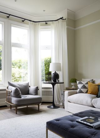 white living room with sheer curtains