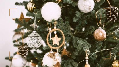 sustainable white and gold Christmas decorations on a green Christmas tree 