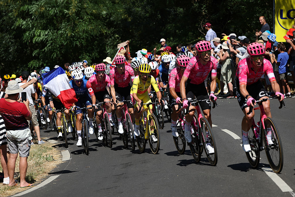 EF Education - EasyPost team's Irish rider Ben Healy wearing the overall leader's yellow jersey cycles with the pack of riders (peloton) during the 11th stage of the 112th edition of the Tour de France cycling race, 156.8 km starting and finishing in Toulouse, southwestern France, on July 16, 2025. (Photo by Anne-Christine POUJOULAT / AFP)