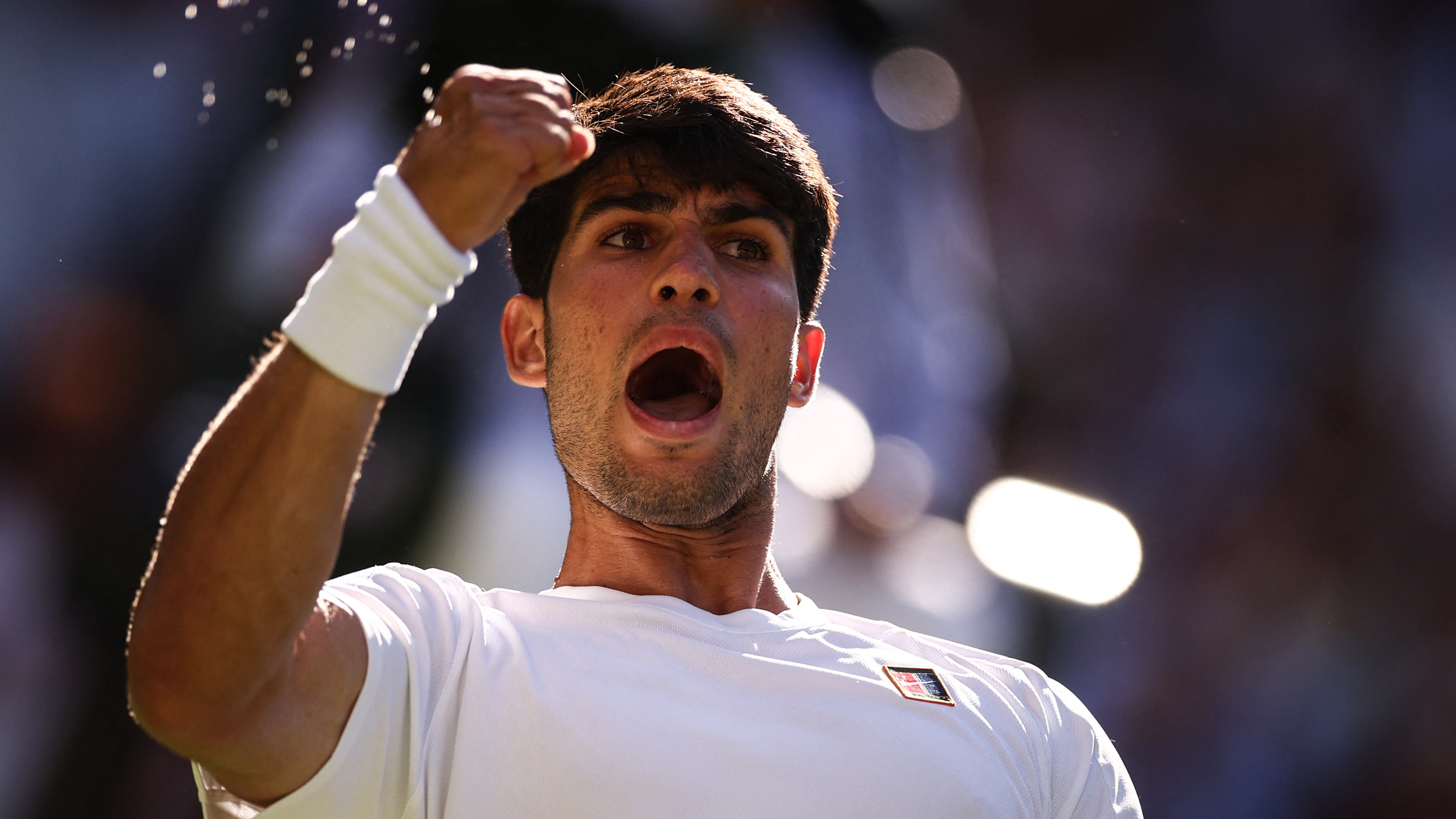 Carlos Alcaraz celebrates a point at Wimbledon 2025