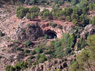 Grotte des Pigeons viewed from the surrounding hills