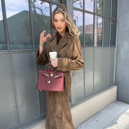 Elsa Hosk wearing a brown suede coat