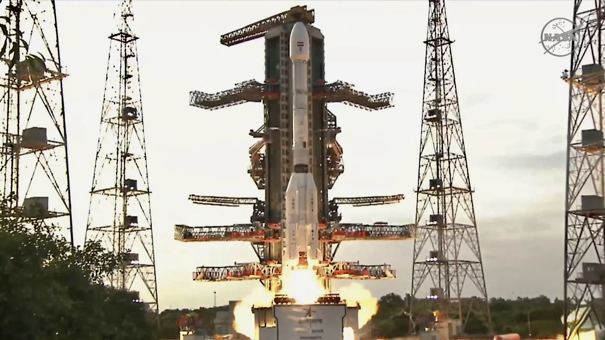 A white rocket with fat bottom lifts off