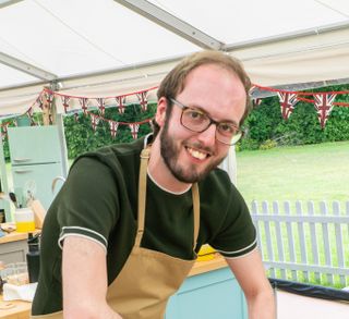 Tom, a contestant from The Great British Bake Off 2021
