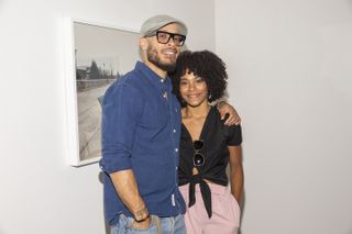 Pete Chatmon and Kelly McCreary attend the private reception celebrating the opening of "Kwame Brathwaite: Celebrity and The Everyday" at Philip Martin Gallery on November 03, 2018 in Los Angeles, California.