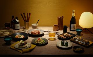 From left: Tsukemono pickles; miso pulled pork buns; takoyaki; crab, edamame and salmon eggs; spinach with black sesame sauce; teriyaki chicken shitake skewers; and whelks with yuzu and jalapeno