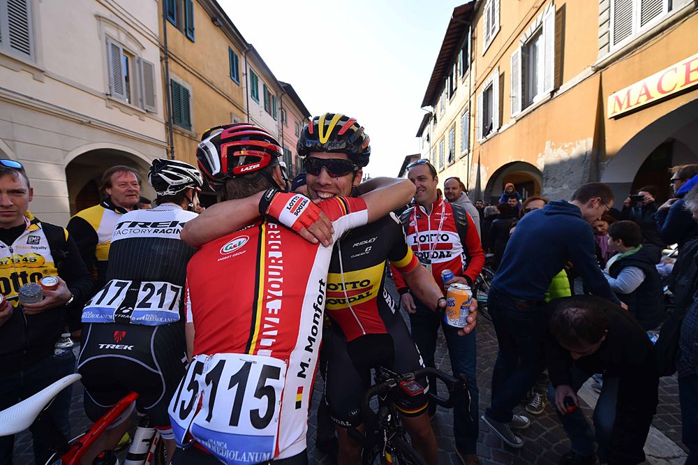 Jens Debusschere (Lotto-Soudal) gets a hug from his teammate after winning stage 2
