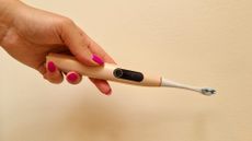 Oclean X Pro Digital S electric toothbrush on a cr&egrave;me background