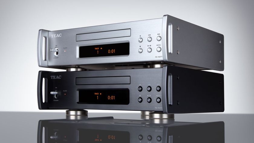 Angled view of two TEAC PD-507T CD transports stacked together, one silver and one black. Both are on a reflective dark surface against a pale grey background