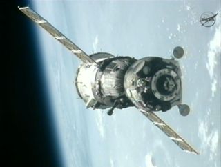 A Russian Soyuz TMA-05M spacecraft nears the International Space Station with the blue Earth in the background in this view from a station camera during a July 17, 2012 docking of the Expedition 32 crew.