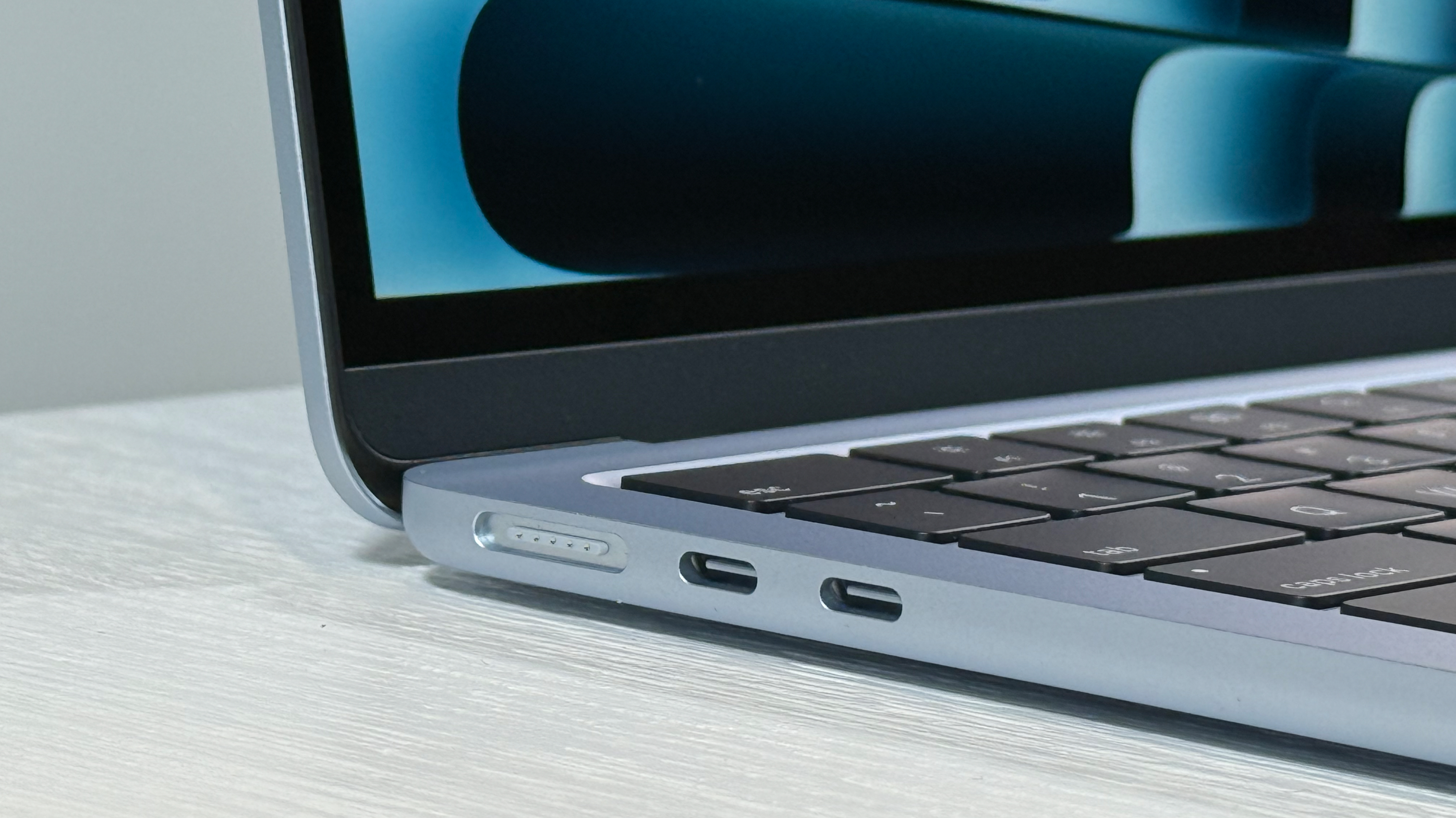 Up-close MagSafe and ports on 13-inch MacBook Air M4 in Sky Blue