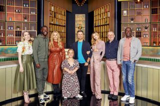 The celebrities of Cooking With The Stars series 4 in a group shot in the studio. From left to right: Katherine Ryan, Harry Pinero, Carol Vorderman, Ellie Simmons, Pasha Kovalev, Abbey Clancy, Christopher Biggins and Linford Christie