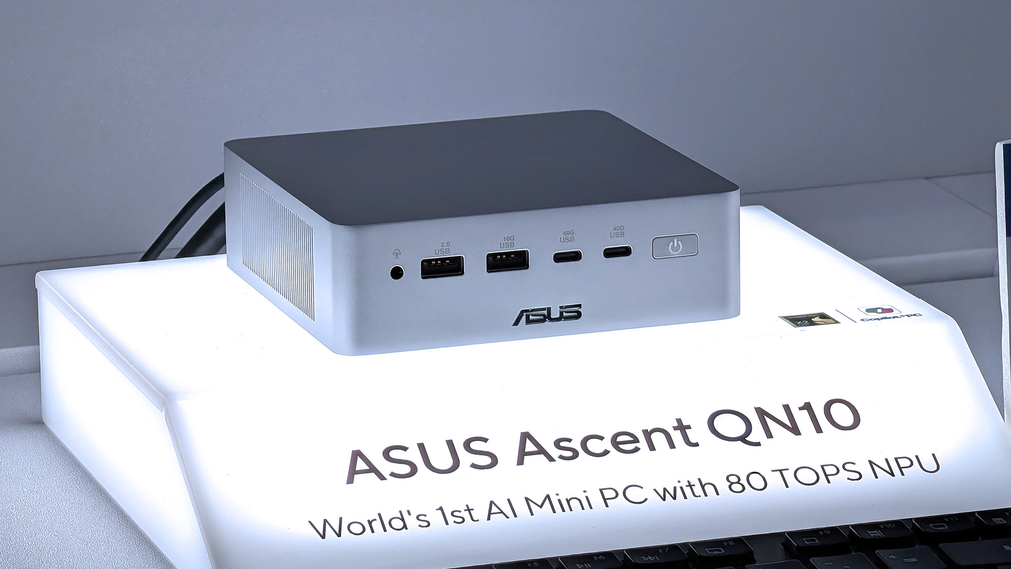 ASUS Ascent QN10 mini PC on an illuminated display at Computex 2026 in Taipei