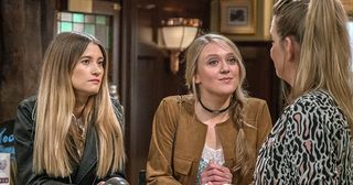 Charity Dingle is intrigued when she hears Debbie Dingle and Rebecca White talking business. Realising they’re keeping the business secret from Lawrence, she blackmails them saying she will keep quiet if she’s made an equal partner IN Emmerdale.