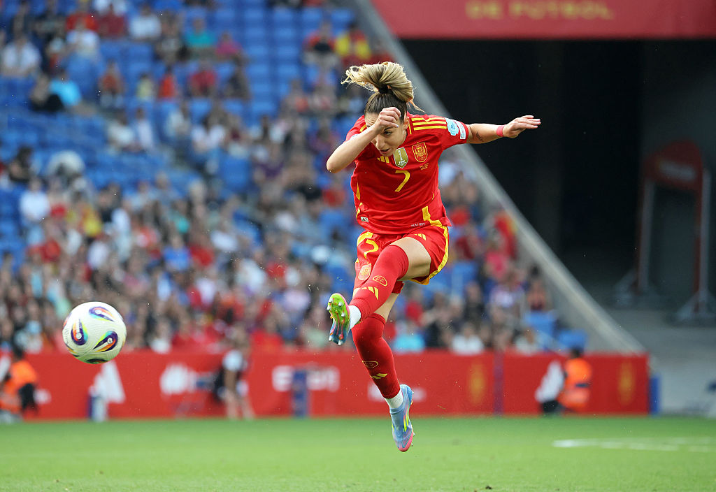 Olga Carmona kicking a ball