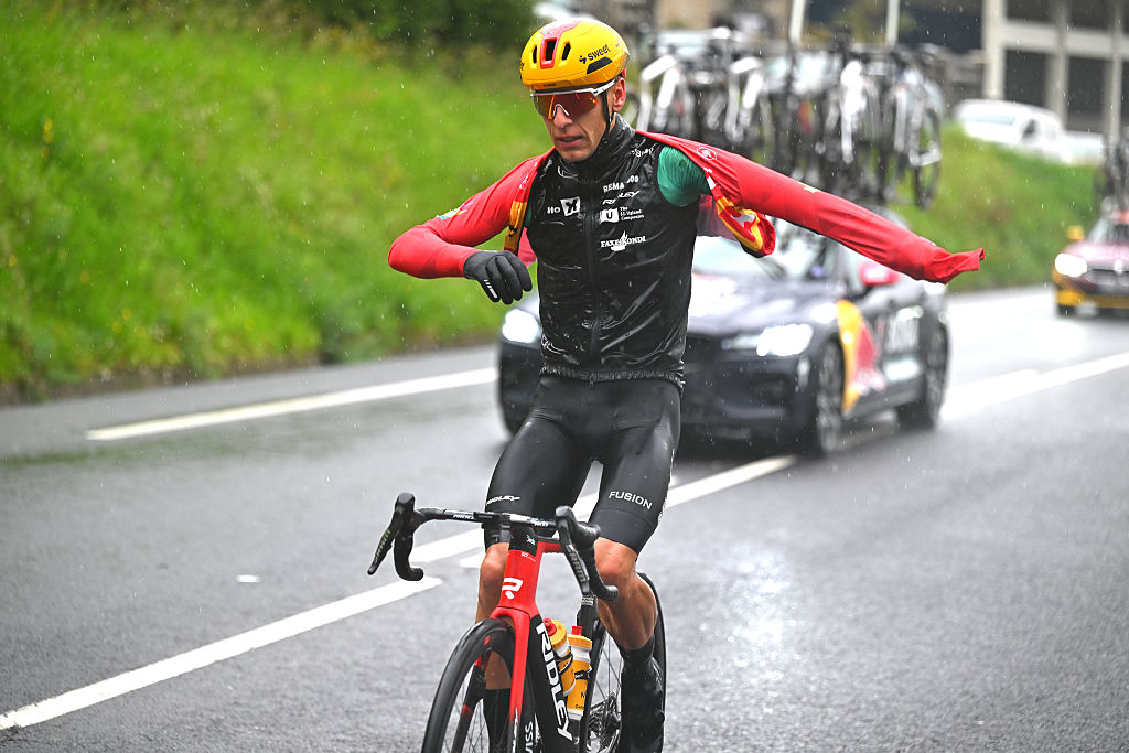 BERGARA, SPAIN - APRIL 11: Tobias Halland Johannessen of Norway and Team Uno-X Mobility - Green Points Jersey assisted by the team car during the 65th Itzulia Basque Country 2026, Stage 6 a 135.2km stage from Goizper-Antzuola to Bergara / #UCIWT / on April 11, 2026 in Bergara, Spain. (Photo by Tim de Waele/Getty Images)