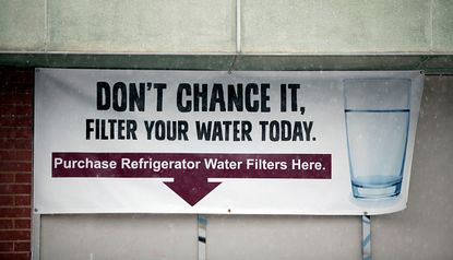 A banner in Flint warns residents not to drink the water.