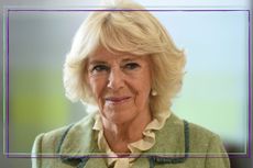 Camilla, the Queen Consort smiling slightly while wearing a green coat / in a purple and green template