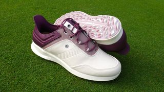 FootJoy Stratos Women's golf shoe resting on the golf course