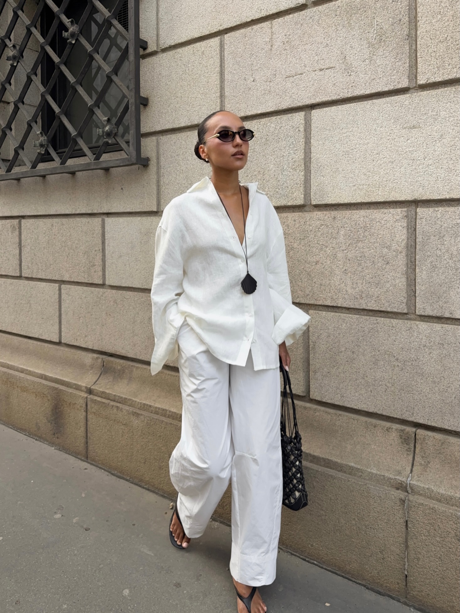 Ingrid in white shirt and trousers
