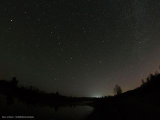 Stargazer Bill Longo captured this meteor view (center right) during the Camelopardalid meteor shower spawned by Comet 209P/LINEAR on May 24, 2014 as seen from Sudbury in Canada.