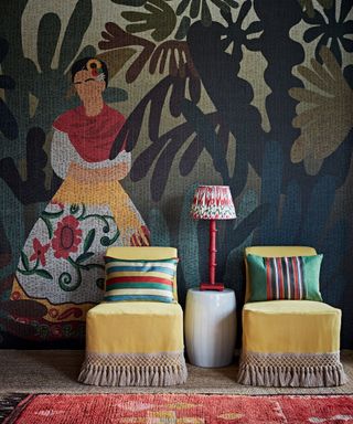The 2021 global living room trend shown by a large Frieda Kahlo mural and yellow chairs.