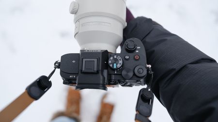 The Sony A7 V covered in snow
