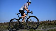 Woman riding a Genesis Croix de Fer offroad