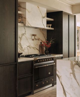 marble kitchen with black cabinetry