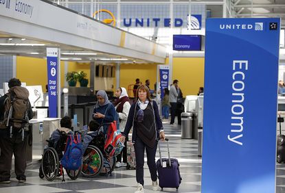 Passengers in the United terminal at O'Hare Airport.