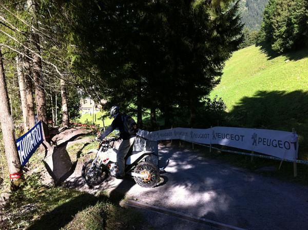 Even the moto drivers were practicing their lines. This driver makes the u-turn at the top of a steep, fireroad climb onto rooty singletrack.