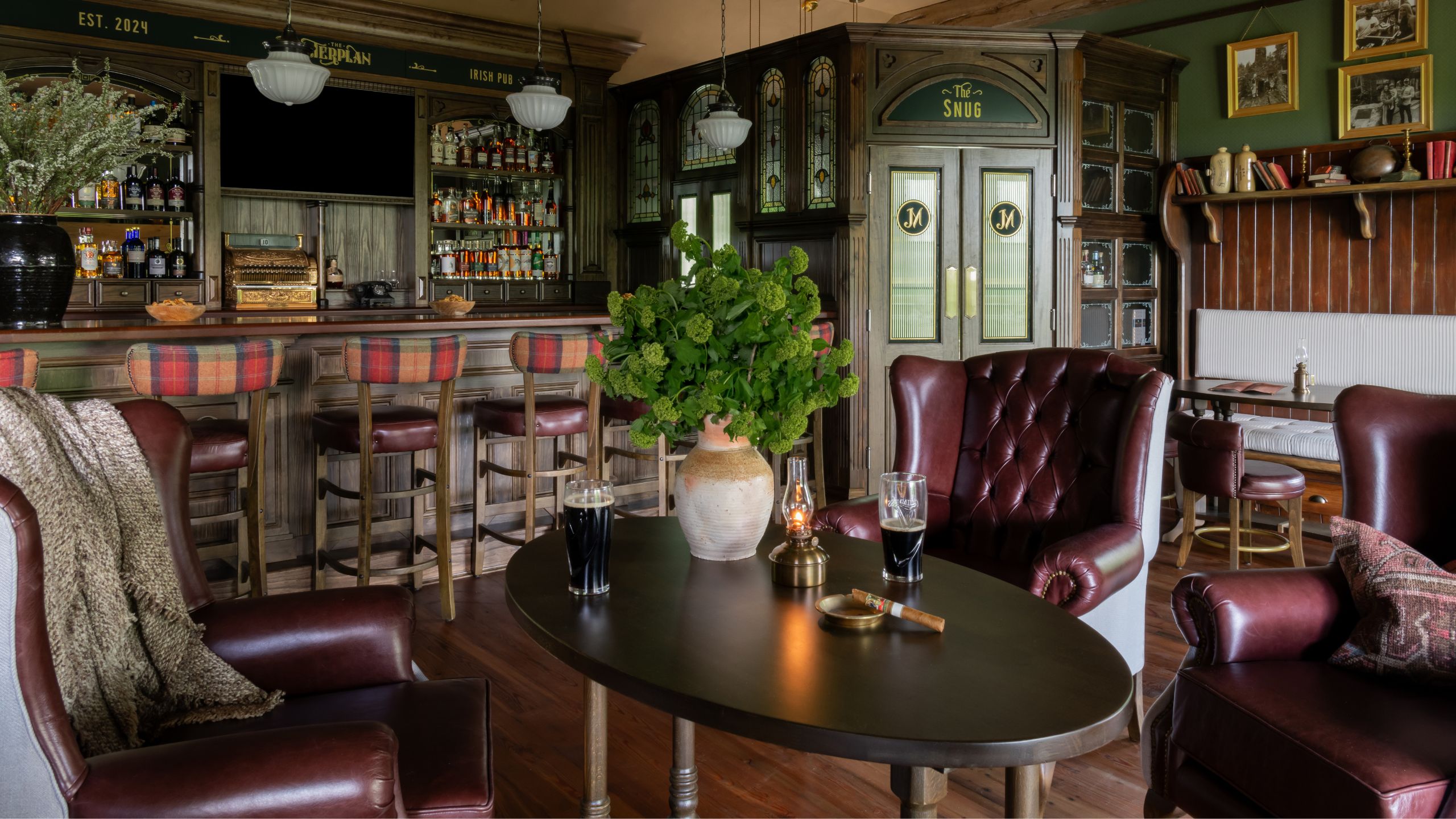 an authentic Irish pub built in a home in Tennessee with traditional bar, leather seating and antique decor