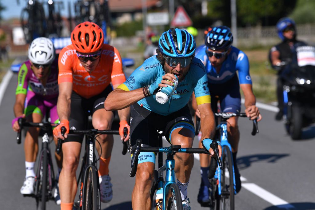 TURIN ITALY AUGUST 05 Alessandro Tonelli of Italy and Team Bardiani Csf Faizane Gijs Van Hoecke of Belgium and CCC Team Manuele Boaro of Italy and Astana Pro Team Refreshment Tacx bottle Breakaway during the 101st Milano Torino 2020 a 198km race from Mesero to Stupinigi Turin MilanoTorino on August 05 2020 in Stupinigi Turin Italy Photo by Tim de WaeleGetty Images