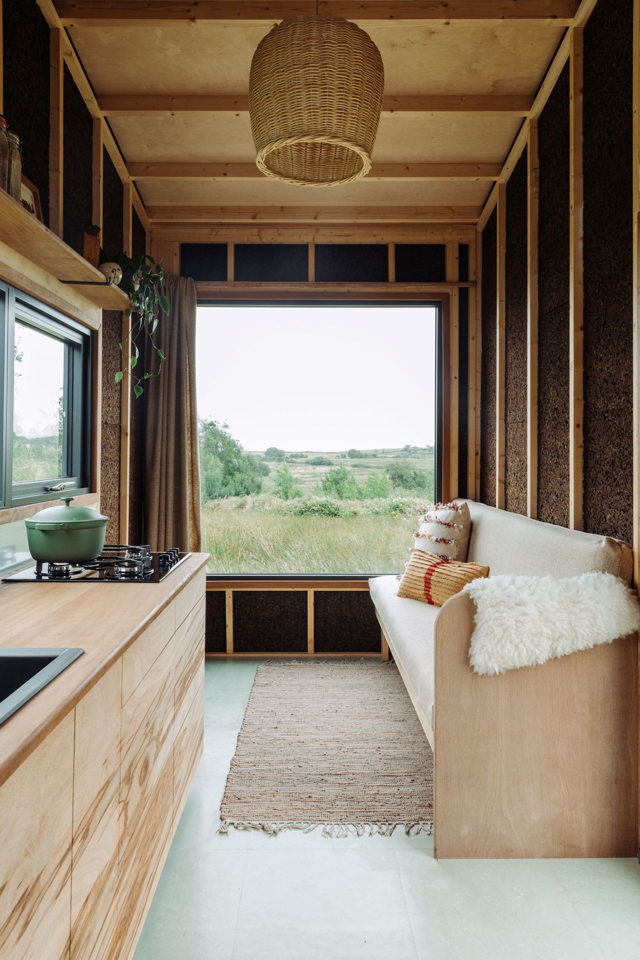 The living area inside a tiny home built with hemp insulation and cork