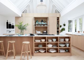 a kitchen with a pendant light hanging in the roof lantern