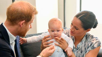 Prince Harry, baby Archie, and Meghan Markle.