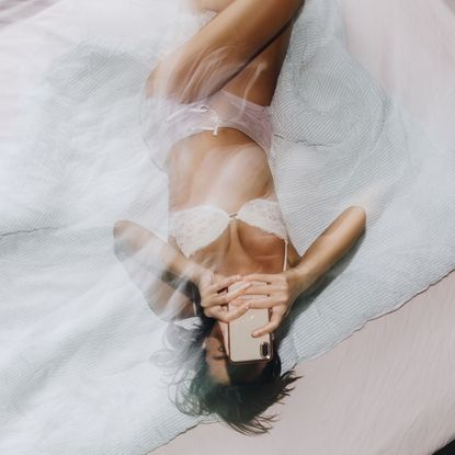 A woman reading some dating profile tips