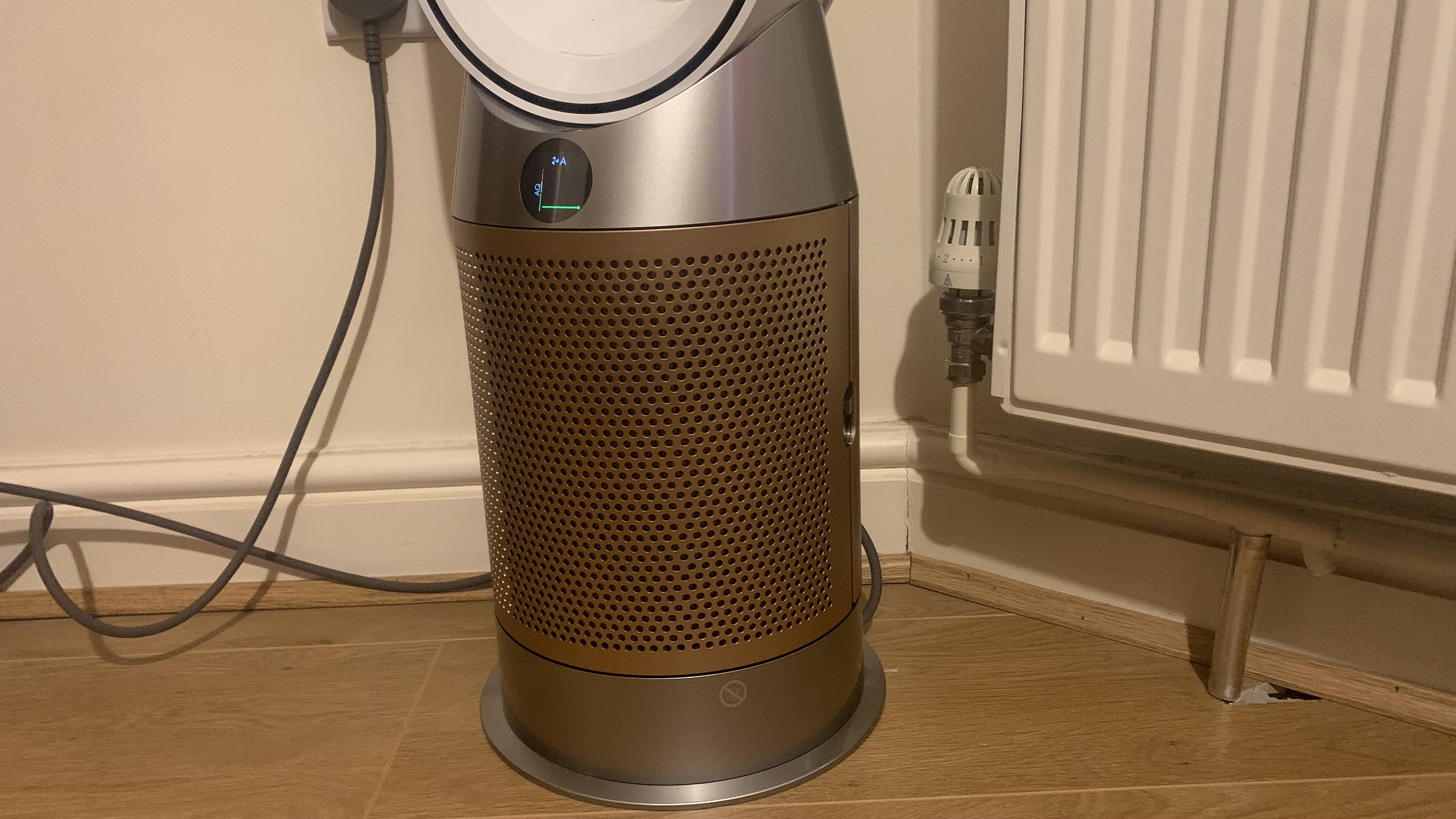 base of the dyson hot + cool is encased in matte gold