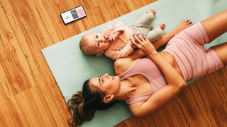 a photo of a mum and baby doing a workout