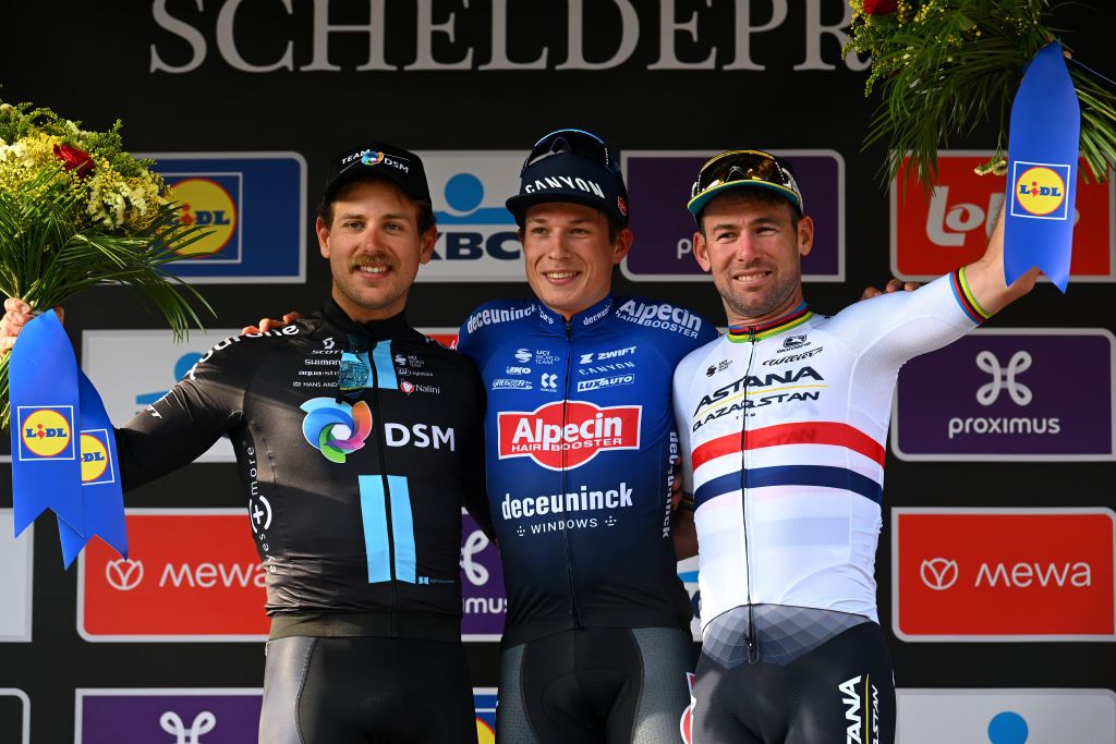 Scheldeprijs 2023 men&#039;s podium: Sam Welsford (Team DSM) in second, Jasper Philipsen (Alpecin Deceuninck) first and Mark Cavendish (Astana Qazaqstan) in third