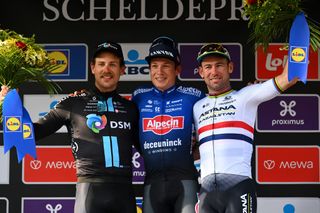 Scheldeprijs 2023 men's podium: Sam Welsford (Team DSM) in second, Jasper Philipsen (Alpecin Deceuninck) first and Mark Cavendish (Astana Qazaqstan) in third
