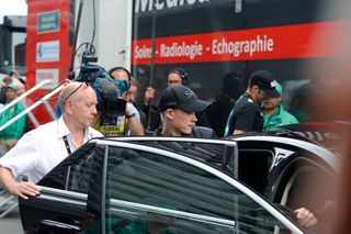 Chris Froome departs from the stage four finish in Lille at the Tour after visiting the medical truck to check injuries sustained in a crash that day. Froome started the following day but would abandon after crashing again in a weather-affected stage five.
