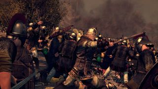 Two warriors fight on a smoke-filled battlefield in Total War: Attila