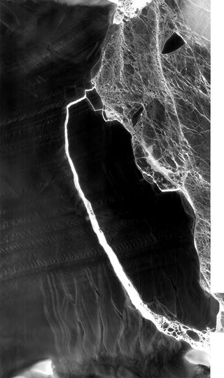 Gorgeous new "dark" images of a massive iceberg moving off from the Larsen C ice shelf in Antarctica were recently captured by a NASA infrared sensor aboard a satellite.