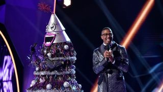 Nick Cannon with a tree in The Masked Singer