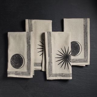 Celestial Napkin Sets against a black background.